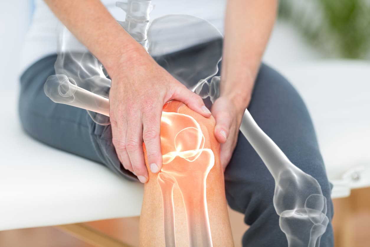 Cropped shot of man holding knee after knee replacement in Union County, NJ